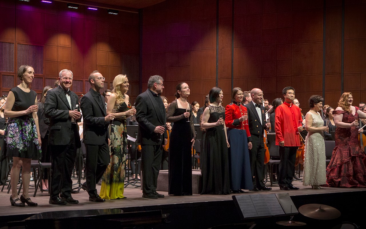 CCM alumni stand for applause at the Sesquicentennial Gala Alumni Showcase on the Corbett Auditorium stage. 