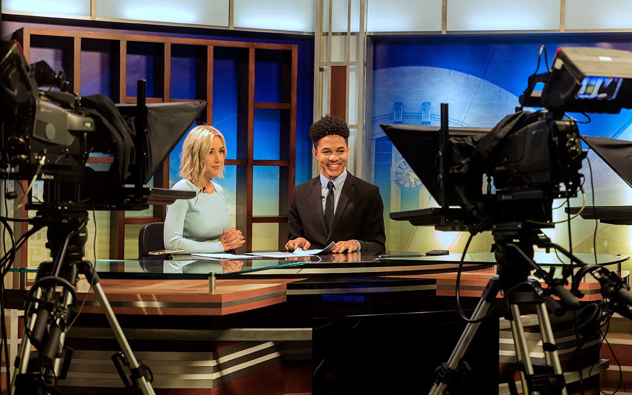 Two students film a broadcast in the Bartlett Television Center