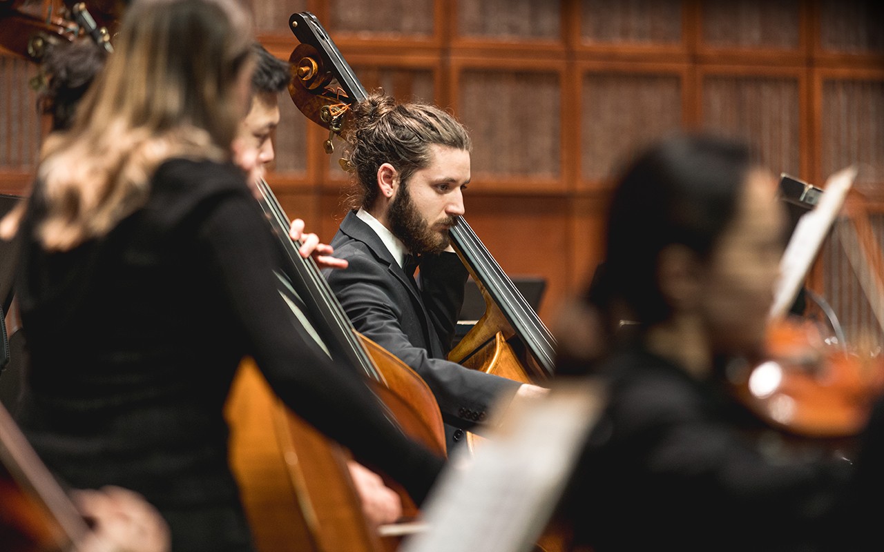CCM Philharmonia students perform double bass on the Corbett Auditorium stage