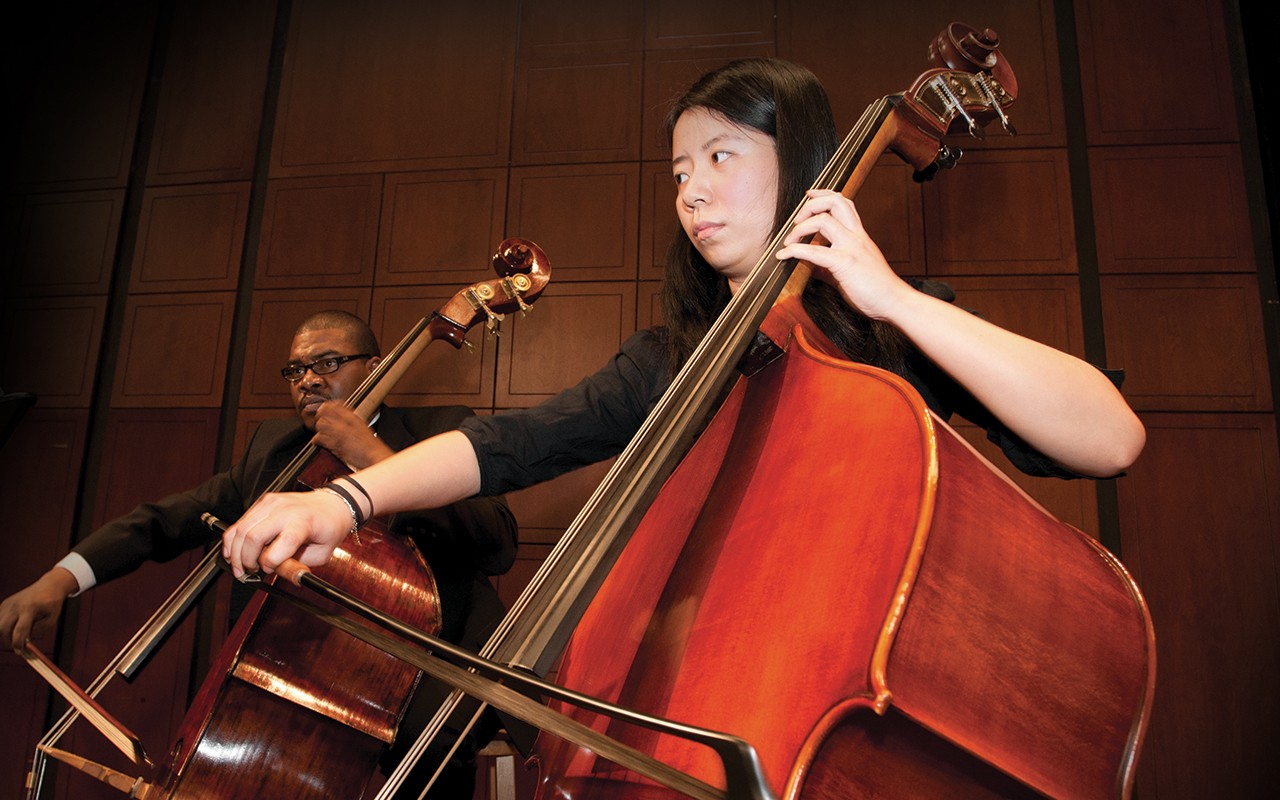 CCM Philharmonia students perform double bass on the Corbett Auditorium stage