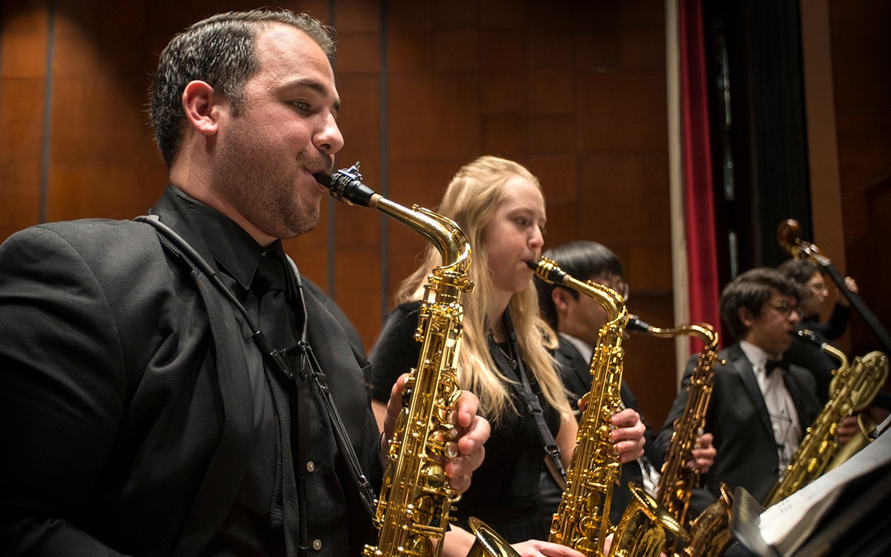Saxophone students perform with the concert orchestra in Corbett Auditorium